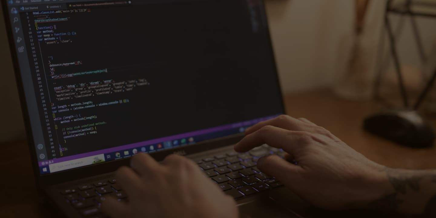 Man programming at computer